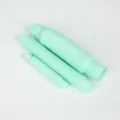 Details of the pastel green telescopic pop tubes, showing flexible corrugated plastic design. - Green