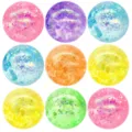 Close-up details of colorful glitter decompression squeeze balls with sparkling sequins inside. - Multicolor