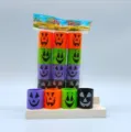Mini plastic spring rainbow toys with cute Halloween pumpkin face design, perfect for party favors. - Halloween Expression Model N