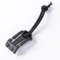 Outdoor backpack strap fastener with black elastic bungee cord for tactical gear organization. - Black