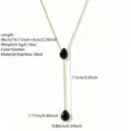 Detailed close-up of the gold stainless steel Y-shaped necklace with black teardrop pendants. - Waterdrop Pendant (RT163XL) / Black (RT163XL-black)