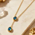 Elegant 18K gold plated stainless steel Y necklace featuring blue teardrop crystal pendants. - Waterdrop Pendant (RT163XL) / Blue (RT163XL-blue)