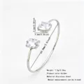 Stainless steel open cuff bracelet with dual round cubic zirconia stones, elegant jewelry. - Gold Double Round Open Bangle (RT138SZ-1)