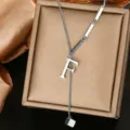 Detail view of the silver stainless steel letter F pendant necklace with elegant chain design. - Letter F Style (WY006-1-F)