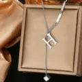 Detailed close-up of stainless steel letter H pendant necklace, elegant versatile jewelry. - Letter H Style (WY006-1-H)