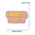 Pink glitter embroidered patch with yellow alphabet text, stylish DIY accessory for hats. - I WANT IT, I GOT IT Slogan (PE18032CT)