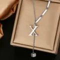 Close-up of stainless steel letter X pendant Y necklace, stylish titanium steel jewelry. - Letter X Style (WY006-1-X)