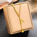 Gold titanium steel letter A pendant necklace detail shot, elegant jewelry display accessory. - Letter A (WY006SL) / Gold