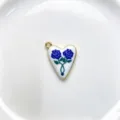 Close-up of a heart-shaped enamel pendant featuring blue rose patterns and a polished gold rim. - Pendant Only (Without Chain) / Blue Rose Style (C01-2)