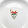 Detail shot of a charming heart enamel pendant featuring dual red roses and gold trim. - Pendant Only (Without Chain) / Red Rose Style (C01-3)