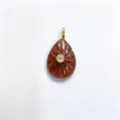 Closeup detail view of carved teardrop gemstone pendant featuring a center set brilliant zircon. - Pendant Only (Without Chain) / Strawberry Quartz