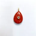 Detailed view of carved red teardrop gemstone pendant with sparkling center crystal accent. - Pendant Only (Without Chain) / Red Agate