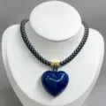 Black and white woven rope necklace with glossy dark blue heart pendant, fashion jewelry detail. - B03 Finished Necklace / Black and White Cord with Dark Blue Heart