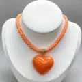 Orange braided necklace with glossy heart pendant fashion jewelry accessory details. - B12 Finished Necklace / Orange and White Cord with Orange Heart