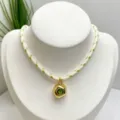 Retro French irregular green zircon gold plated pendant necklace detail on white display bust - Necklace (With Pendant and Chain) / Green and White Braided Rope