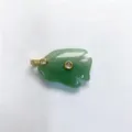 Close-up of carved green jade fish pendant with sparkling zircon inlay and gold hardware detail. - Pendant Only / Green Aventurine