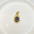 Exquisite gold teardrop pendant featuring a beautiful central purple crystal stone. - Pendant Only (Without Chain) / Purple