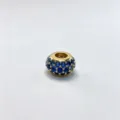Close-up detail of a gold plated DIY charm bead with sparkling blue cubic zirconia stones. - Gold (D08)