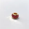 Close up of micro pave red zircon charm bead, gold plated DIY jewelry accessory detail view. - Gold (D10)