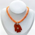 Detailed view of a unique gemstone carved fish pendant necklace with sparkling zircon accents. - Pendant Necklace Set (U12) / Orange Red