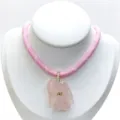 Charming pink woven rope necklace featuring a carved crystal fish pendant with sparkling zircons. - Necklace / Rose Quartz