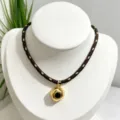 Retro French style irregular gold plated pendant necklace with dark brown braided cord. - Necklace (With Pendant and Chain) / Dark Brown Braided Rope