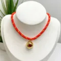 Red and yellow woven rope necklace featuring a gold irregular pendant with a red zircon stone. - Necklace (With Pendant and Chain) / Red and Yellow Braided Rope