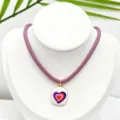Close-up detail of the colorful enamel heart pendant necklace with purple cord and gold frame. - K02-2 (Pendant + Chain in Picture)