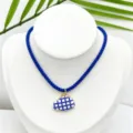 Blue rope cord necklace featuring blue and white grid ceramic cloud pendant detail. - K02-11 (Pendant with Chain as Pictured)