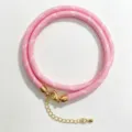 Pink braided rope necklace detail with gold metal clasp and adjustable extension chain. - A-18 Pink