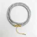 Grey braided rope cord necklace detail with golden metal clasp and adjustable extension chain - A-24