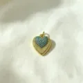 Close-up detail of the gold heart pendant featuring sparkling blue cubic zirconia pavé stones. - Heart Micro-inlaid Pendant(J-02)