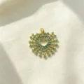 Exquisite close-up detail of the gold heart pendant featuring sparkling turquoise zircon stones. - Ray Heart Pendant(J-07)