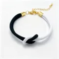Two-color woven rope bracelet with gold-tone metal components and adjustable extension chain. - 13#