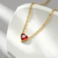 Detail view of the gold-plated heart pendant necklace with radiant red gemstone, elegant style. - Heart Rhinestone Red - x1326