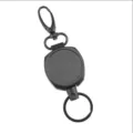 Black metal retractable badge reel detail, heavy duty key holder carabiner mechanism close up - Style 2