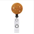 Intrekbare badgehouder met amberkleurige strass ronde kop en metalen clip voor ID-kaarten. - Oranje