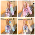 Detail view of cute mini water ring toss game keychain with liquid and strap pendant. - Girl Figure Style / 7.8x4.8cm