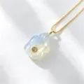 Detailed shot of a cute carved natural gemstone turtle pendant necklace with a fine gold chain. - White Turtle (E04) / Single Pendant (Chain Not Included)