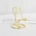 Minimalist gold metal phone holder desktop stand, elegant wire design for desk display. - Gold