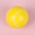 Yellow tennis shaped PU foam stress relief ball detail close up view for daily fun play - 6cm / Tennis Ball