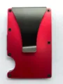 Close-up detail of the stylish red aluminum RFID blocking card wallet with black money clip. - Red