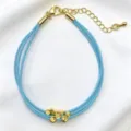 Bracciale in corda intrecciata blu a più fili con perline dorate e ciondolo a farfalla. - 16# (Celeste)