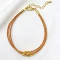 Primo piano del bracciale in maglia dorata multistrato con perline delicate e chiusura. - 17# (Oro Champagne)