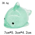 Green sparkly dolphin squishy toy, compact size and lightweight design for stress relief. - Large Glitter Dolphin