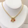 Gold-plated multi-pendant necklace with red stone and cubic zirconia star charm. - Micro-Pave Heart Starburst Style (02#) / Pendant with Necklace / Gold