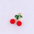 Close up view of a cute 3D cherry charm pendant with red fruit and green enamel leaves. - Style H