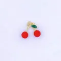 Close-up detail of the cute red cherry charm, featuring golden stem and glossy finish. - Style D