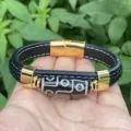 Men retro leather braided bracelet with golden metal buckle and central dzi bead detail. - Retro Totem A Style