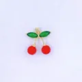 Gold cherry pendant necklace charm with green crystal leaves and red bead fruits detail shot - Style F